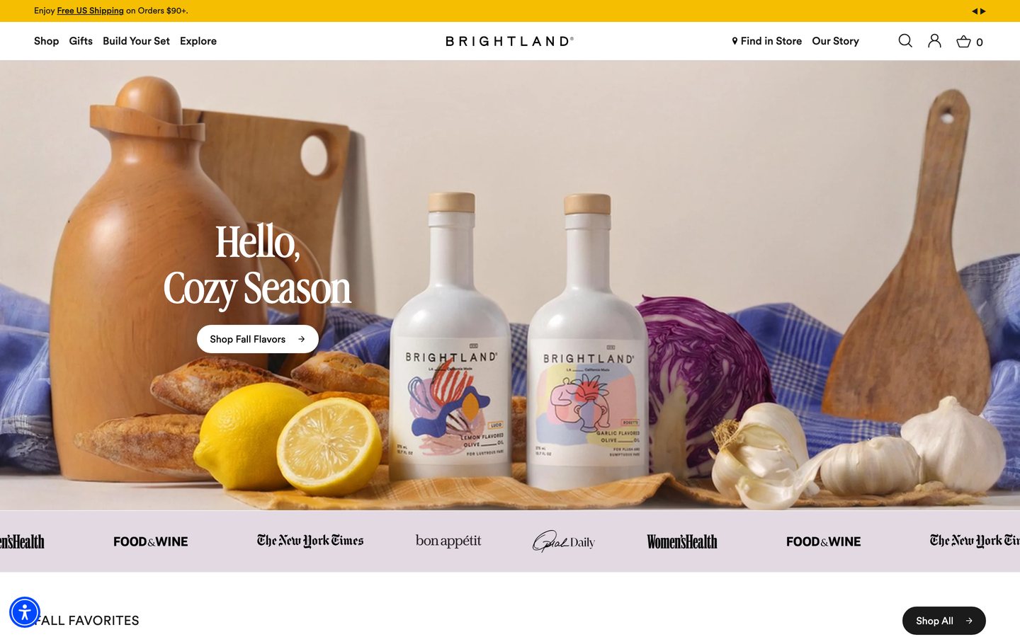 Brightland's homepage first screen today: a full-width seasonal photo under the headline Hello, Cozy Season with a Shop Fall Flavors button.